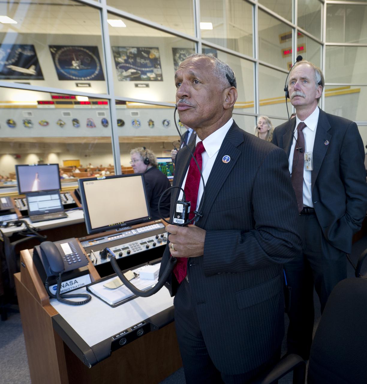 NASA Administrator Charles Bolden and other NASA management watch the launch of space shuttle Discovery (STS-133) from the firing room at Kennedy Space Center, Thursday, Feb. 24, 2011, in Cape Canaveral, Fla. Discovery, on its 39th and final flight, is carrying the Italian-built Permanent Multipurpose Module (PMM), Express Logistics Carrier 4 (ELC4) and Robonaut 2, the first humanoid robot in space to the International Space Station. Photo Credit: (NASA/Bill Ingalls)