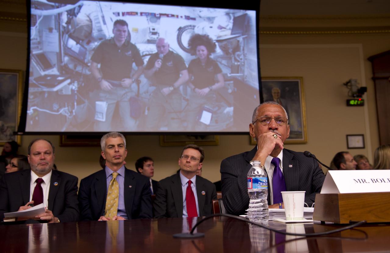 NASA Administrator Charles Bolden, right, listens as a video message from the current crew of the International Space Station is played back at start of a House Committee on Science, Space, and Technology budget hearing, Wednesday, March 2, 2011 in the Rayburn House Office Building on Capitol Hill in Washington.  Photo Credit: (NASA/Bill Ingalls)