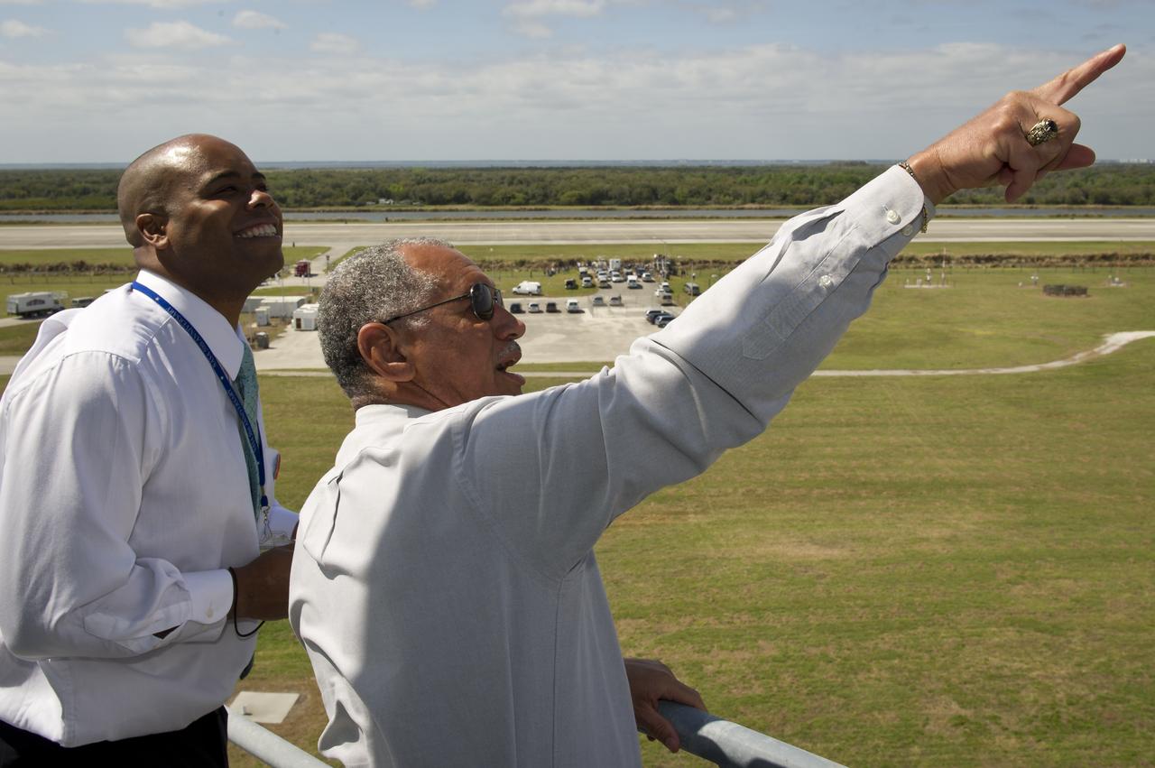 NASA Administrator Charles Bolden, right, and NASA Executive Officer to the Deputy Administrator Garvey McIntosh scan the sky for the space shuttle Discovery as it approaches for landing from its 39th and final flight at the Kennedy Space Center in Cape Canaveral, Fla., Wednesday, March 9, 2011. Since 1984, Discovery flew 39 missions, spent 365 days in space, orbited Earth 5,830 times and traveled 148,221,675 miles.  Photo credit: (NASA/Bill Ingalls)
