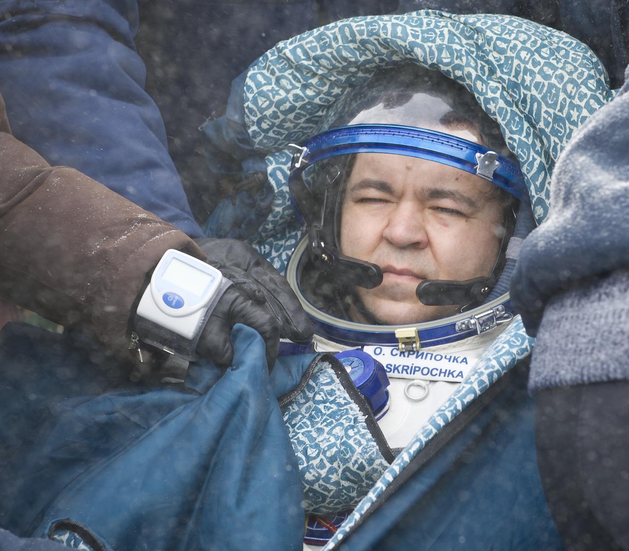 Expedition 26 Flight Engineer Oleg Skripochka rest in a chair shortly after he and fellow crew members Scott Kelly and Alexander Kaleri landed in their Soyuz TMA-01M capsule near the town of Arkalyk, Kazakhstan on Wednesday, March 16, 2011. NASA Astronaut Kelly, Russian Cosmonauts Skripochka and Kaleri are returning from almost six months onboard the International Space Station where they served as members of the Expedition 25 and 26 crews. Photo Credit: (NASA/Bill Ingalls)