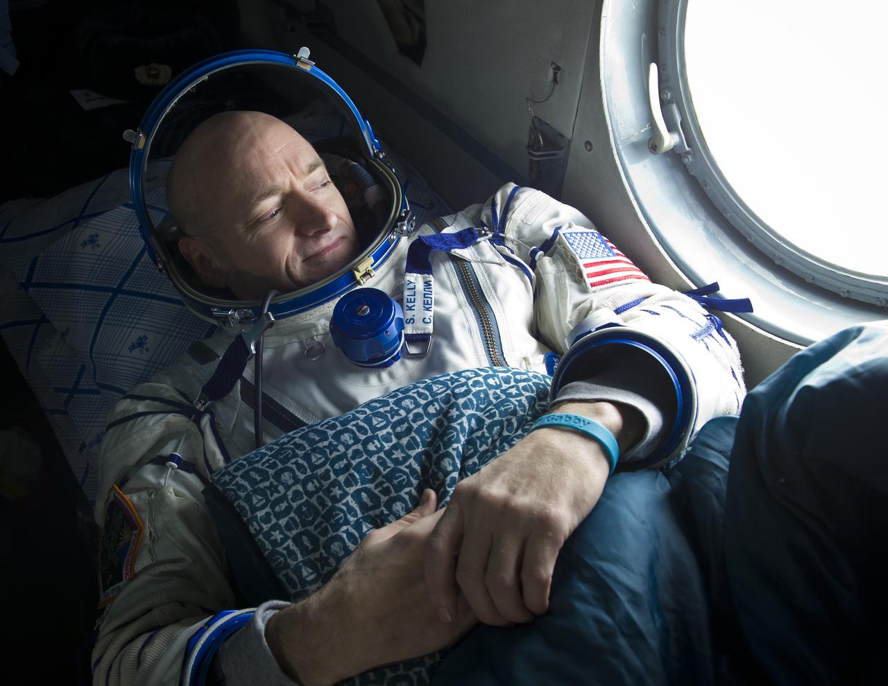 Expedition 26 Commander Scott Kelly looks out the window of a Russian Search and Rescue helicopter before the two hour helicopter ride to Kustanay, Kazakhstan shortly after he and fellow crew members Oleg Skripochka and Alexander Kaleri landed in their Soyuz TMA-01M capsule near the town of Arkalyk, Kazakhstan on Wednesday, March 16, 2011.  NASA Astronaut Kelly, Russian Cosmonauts Skripochka and Kaleri are returning from almost six months onboard the International Space Station where they served as members of the Expedition 25 and 26 crews. Photo Credit: (NASA/Bill Ingalls)