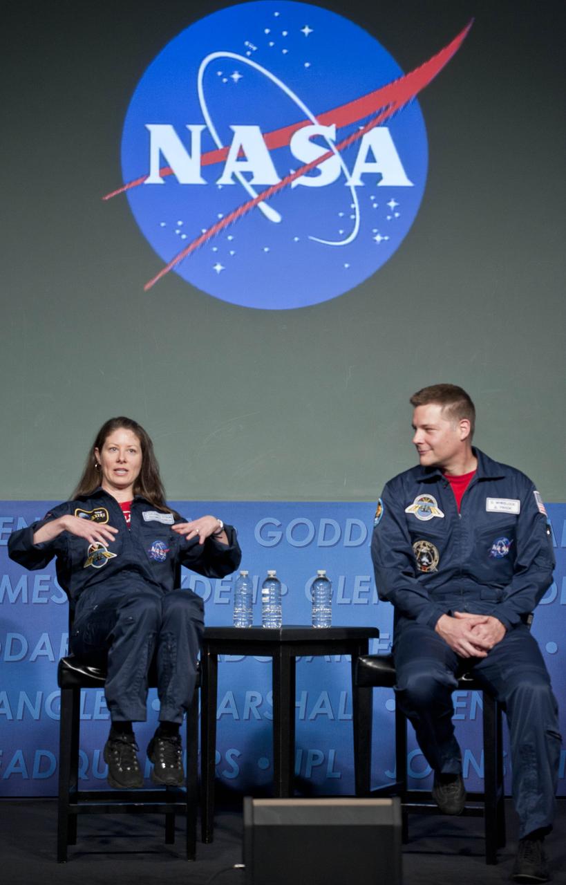 Astronauts Tracy Caldwell Dyson, flight engineer on Expeditions 23 and 24, left, and Doug Wheelock, Expedition 24 flight engineer and commander of Expedition 25, discuss their mission to the International Space Station during a visit to NASA Headquarters in Washington, Wednesday, March 16, 2011. (NASA/Paul E. Alers)