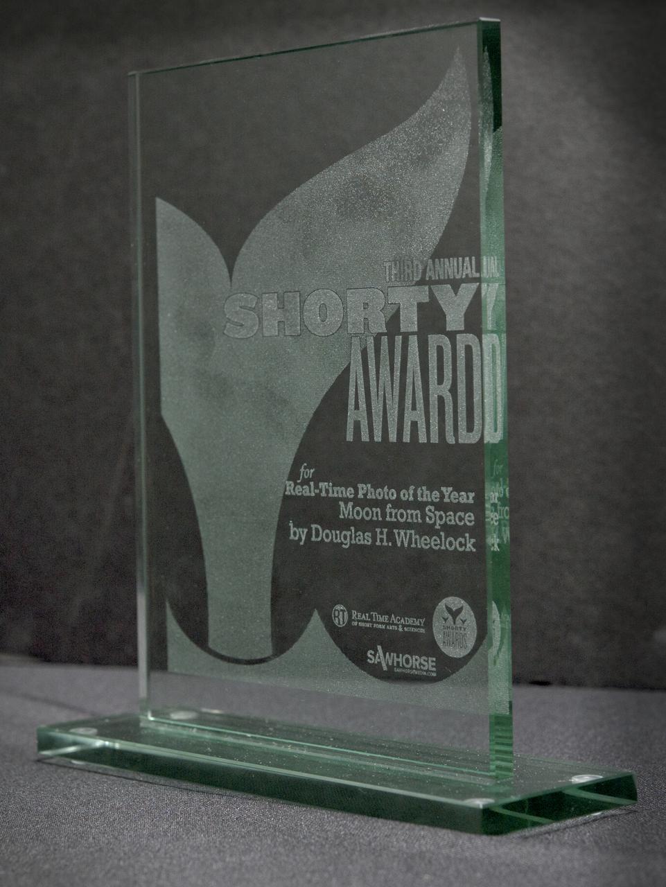 A Shorty Award is seen Wednesday, March 30, 2011 at NASA Headquarters in Washington. The award was presented to NASA astronaut Doug Wheelock for an image of the moon he took and posted to his Twitter account, @Astro_Wheels, while living aboard the International Space Station last year. The awards ceremony was held at the TimesCenter in New York City on Monday, March 28. Photo Credit: (NASA/Paul E. Alers)