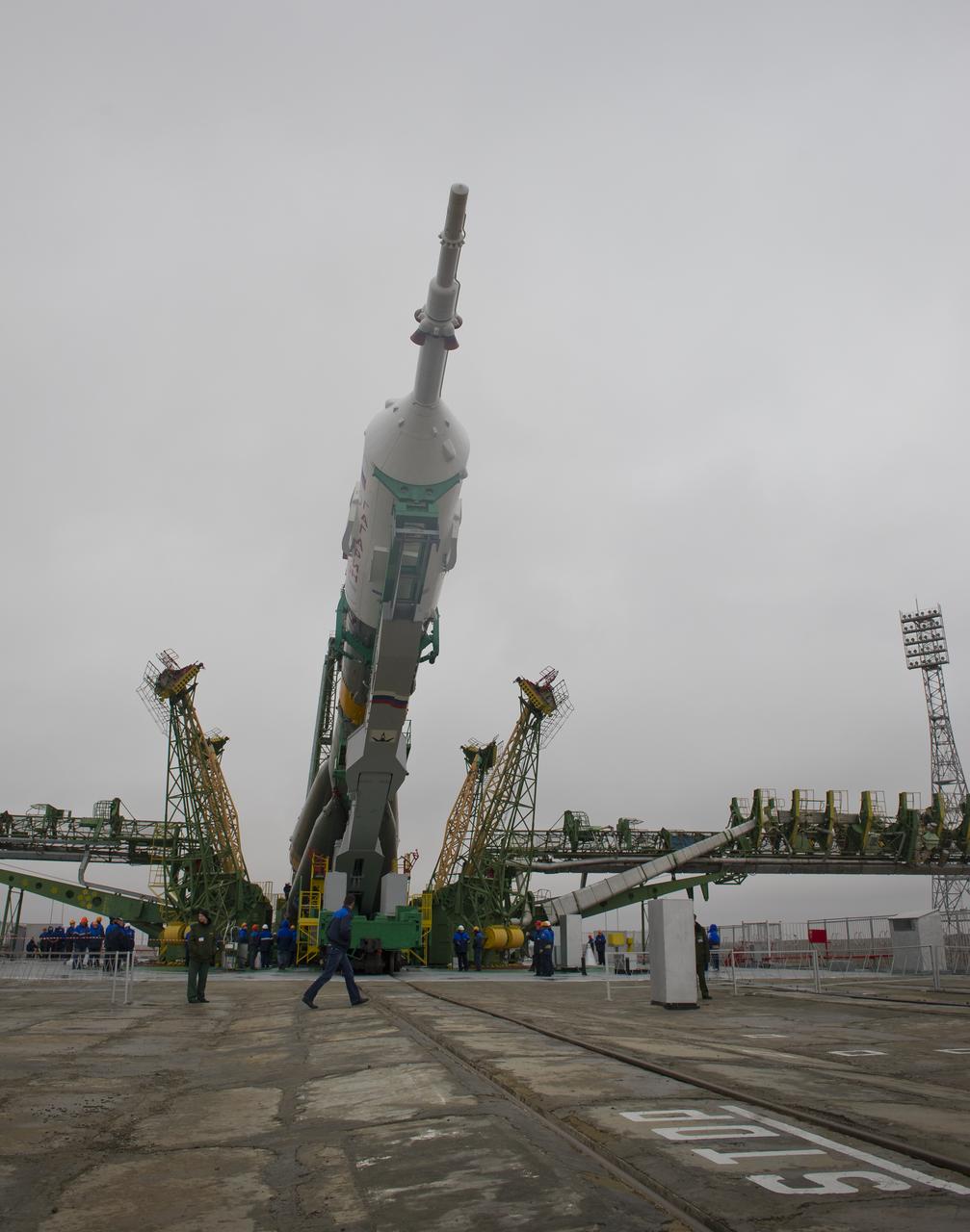 The Soyuz TMA-21 spacecraft is lifted into position on the launch pad at the Baikonur Cosmodrome in Kazakhstan, Saturday, April 2, 2011. The Soyuz, which has been dubbed “Gagarin”, is launching one week shy of the 50th anniversary of the launch of Yuri Gagarin from the same launch pad in Baikonur on April 12, 1961 to become the first human to fly in space. The first stage of the Soyuz booster is emblazoned with the name “Gagarin” and the likeness of the first person to fly in space.  Photo Credit (NASA/Carla Cioffi)