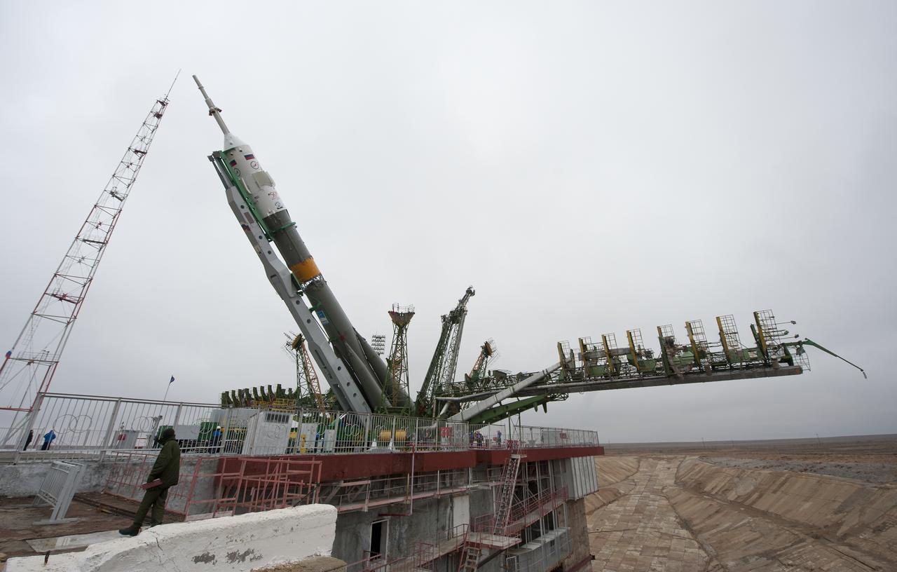 The Soyuz TMA-21 spacecraft is lifted into position on the launch pad at the Baikonur Cosmodrome in Kazakhstan, Saturday, April 2, 2011. The Soyuz, which has been dubbed “Gagarin”, is launching one week shy of the 50th anniversary of the launch of Yuri Gagarin from the same launch pad in Baikonur on April 12, 1961 to become the first human to fly in space. The first stage of the Soyuz booster is emblazoned with the name “Gagarin” and the likeness of the first person to fly in space.  Photo Credit (NASA/Carla Cioffi)