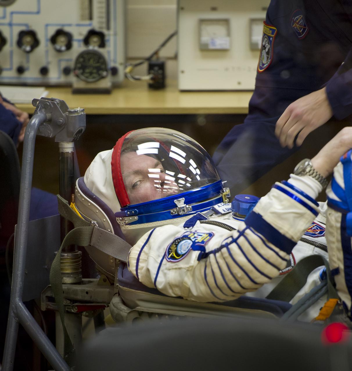 Expedition 27 Soyuz Commander Alexander Samokutyaev has his Russian Sokol suit prepared for launch by a technician at the Baikonur Cosmodrome in Baikonur, Kazakhstan, Tuesday, April 5, 2011. Samokutyaev, NASA Flight Engineer Ron Garan and Russian Flight Engineer Andrey Borisenko launched in their Soyuz TMA-21 rocket from the Baikonur Cosmodrome in Kazakhstan at 4:18 a.m. local time. (Photo Credit: NASA/Carla Cioffi)