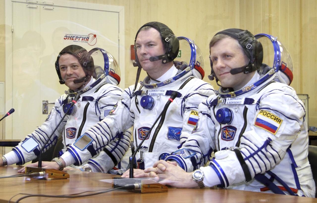 Expedition 27 NASA Flight Engineer Ron Garan, left, Expedition 27 Soyuz Commander Alexander Samokutyaev and Expedition 27 Flight Engineer Andrey Borisenko, right, talk to officials prior to their launch on board the Soyuz TMA-21 spacecraft to the International Space Station, Tuesday, April 5, 2011 at the Baikonur Cosmodrome in Kazakhstan.  The Soyuz, which has been dubbed “Gagarin”, is launching one week shy of the 50th anniversary of the launch of Yuri Gagarin from the same launch pad in Baikonur on April 12, 1961 to become the first human to fly in space.  Photo Credit: (NASA/Victor Zelentsov)