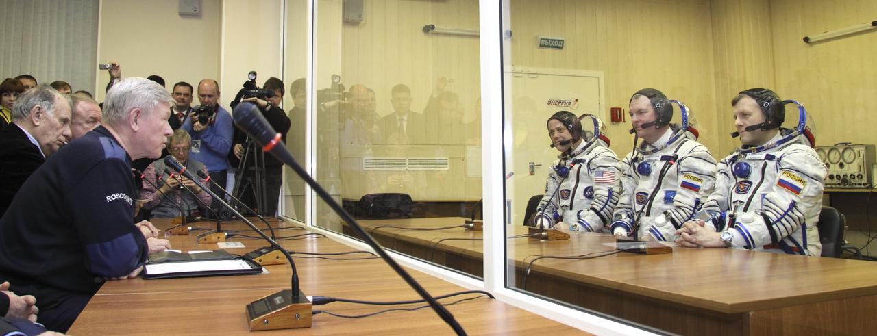 Expedition 27 Russian Flight Engineer Andrey Borisenko, far right, Expedition 27 Soyuz Commander Alexander Samokutyaev and Expedition 27 NASA Flight Engineer Ron Garan, third from right, talk to Head of the Russian Federal Space Agency Anatoly Perminov, far left, prior to their launch on board the Soyuz TMA-21 spacecraft to the International Space Station, Tuesday, April 5, 2011 at the Baikonur Cosmodrome in Kazakhstan.  The Soyuz, which has been dubbed “Gagarin”, is launching one week shy of the 50th anniversary of the launch of Yuri Gagarin from the same launch pad in Baikonur on April 12, 1961 to become the first human to fly in space.  Photo Credit: (NASA/Victor Zelentsov)