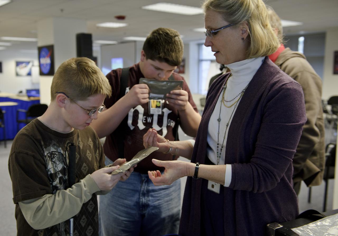 Students from the Maryland School for the Blind learn about space food from NASA Public Affairs specialist Nora Normandy,  right, during  Disability Mentoring Day, Thursday, April 7, 2011, at NASA Headquarters in Washington. Photo Credit (NASA/Paul E. Alers)