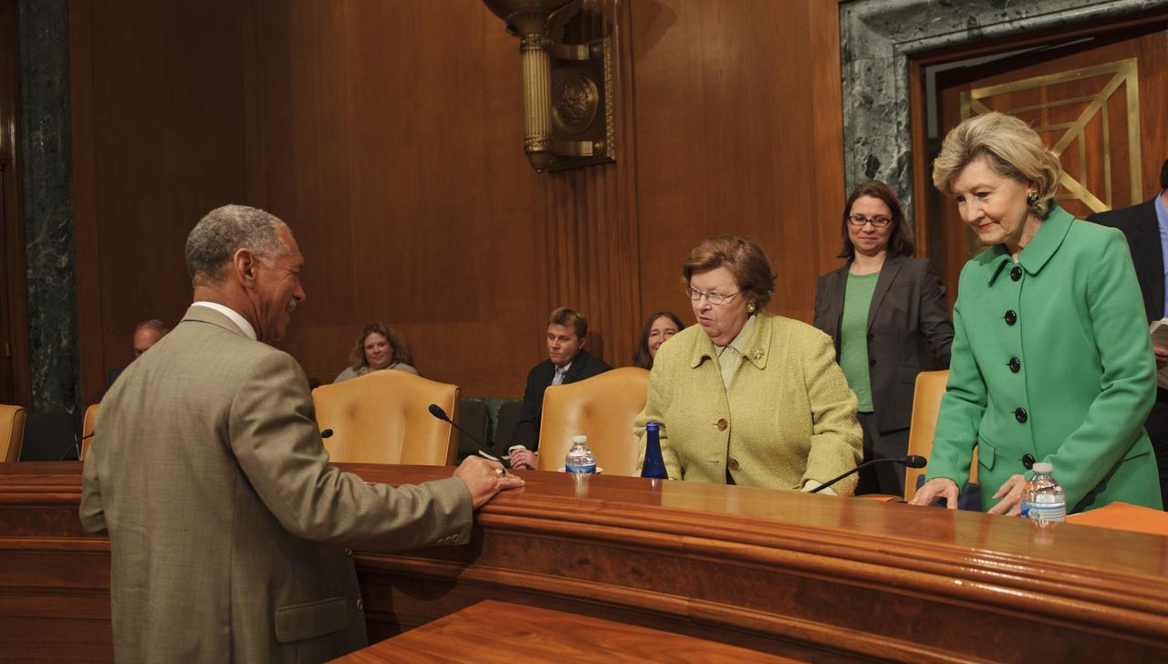 NASA Administrator Charles Bolden, left, speaks with U.S. Sens. Barbara Mikulski, D-Md., center, and Kay Bailey Hutchison, R-Texas, right, prior to his testimony in front of the Senate Appropriations Committee, Monday, April 11, 2011, at the Dirksen Senate Office Building on Capitol Hill in Washington. Photo Credit: (NASA/Paul E. Alers)