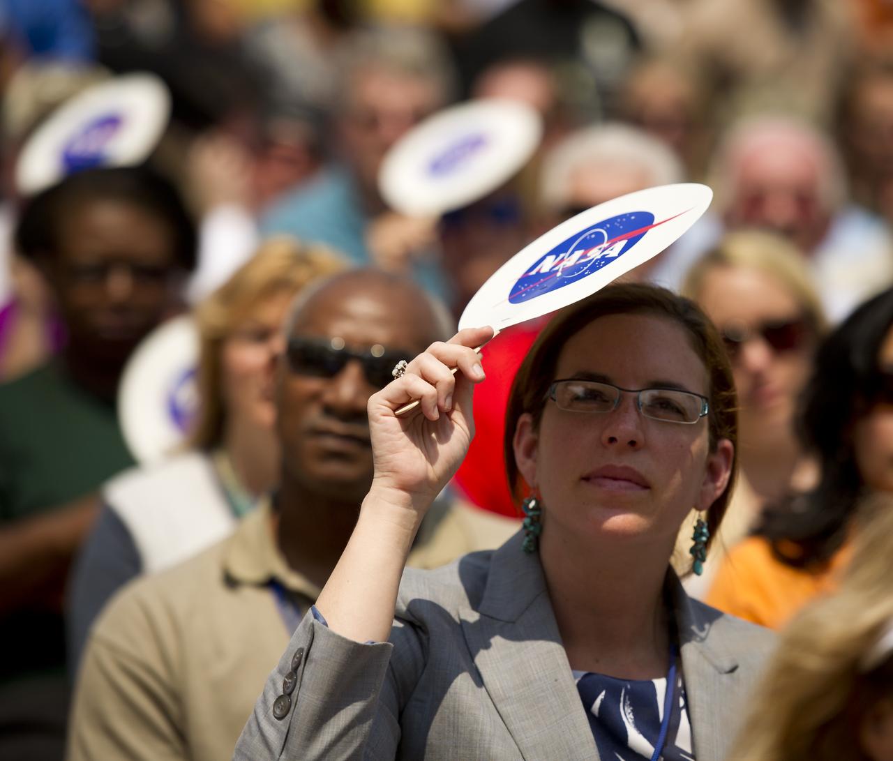 Workers at the NASA Kennedy Space Center listen as NASA Administrator Charles Bolden announces where four space shuttle orbiters will be permanently displayed at the conclusion of the Space Shuttle Program during an event held at one of the Orbiter Processing Facilities, Tuesday, April 12, 2011, at Kennedy Space Center in Cape Canaveral, Fla. The four orbiters, Enterprise, which currently is on display at the Smithsonian's Steven F. Udvar-Hazy Center near Washington Dulles International Airport, will move to the Intrepid Sea, Air & Space Museum in New York, Discovery will move to Udvar-Hazy, Endeavour will be displayed at the California Science Center in Los Angeles and Atlantis, in background, will be displayed at the Kennedy Space Center Visitor’s Complex.  Photo Credit: (NASA/Bill Ingalls)