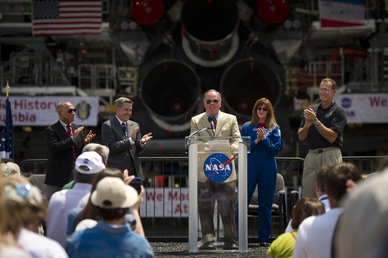 Pilot of the first space shuttle mission, STS-1, Bob Crippen speaks at an event where NASA Administrator Charles Bolden announced where four space shuttle orbiters will be permanently displayed at the conclusion of the Space Shuttle Program, Tuesday, April 12, 2011, at Kennedy Space Center in Cape Canaveral, Fla. The four orbiters, Enterprise, which currently is on display at the Smithsonian's Steven F. Udvar-Hazy Center near Washington Dulles International Airport, will move to the Intrepid Sea, Air & Space Museum in New York, Discovery will move to Udvar-Hazy, Endeavour will be displayed at the California Science Center in Los Angeles and Atlantis, in background, will be displayed at the Kennedy Space Center Visitorâ€™s Complex.  Photo Credit: (NASA/Bill Ingalls)