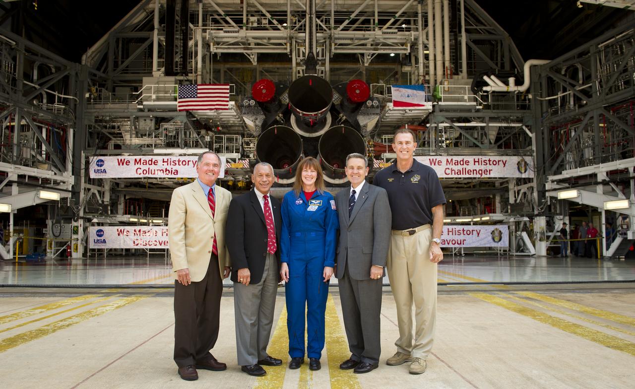From left, Pilot of the first space shuttle mission, STS-1, Bob Crippen, NASA Administrator Charles Bolden, NASA Johnson Space Center Director of Flight Crew Operations, and Astronaut, Janet Kavandi, NASA Kennedy Space Center Director and former astronaut Bob Cabana, and Endeavour Vehicle Manager for United Space Alliance Mike Parrish pose for a photograph outside of the an Orbiter Processing Facility with the space shuttle Atlantis shortly after Bolden announced where four space shuttle orbiters will be permanently displayed at the conclusion of the Space Shuttle Program, Tuesday, April 12, 2011, at Kennedy Space Center in Cape Canaveral, Fla. The four orbiters, Enterprise, which currently is on display at the Smithsonian's Steven F. Udvar-Hazy Center near Washington Dulles International Airport, will move to the Intrepid Sea, Air & Space Museum in New York, Discovery will move to Udvar-Hazy, Endeavour will be displayed at the California Science Center in Los Angeles and Atlantis, in background, will be displayed at the Kennedy Space Center Visitorâ€™s Complex.  Photo Credit: (NASA/Bill Ingalls)