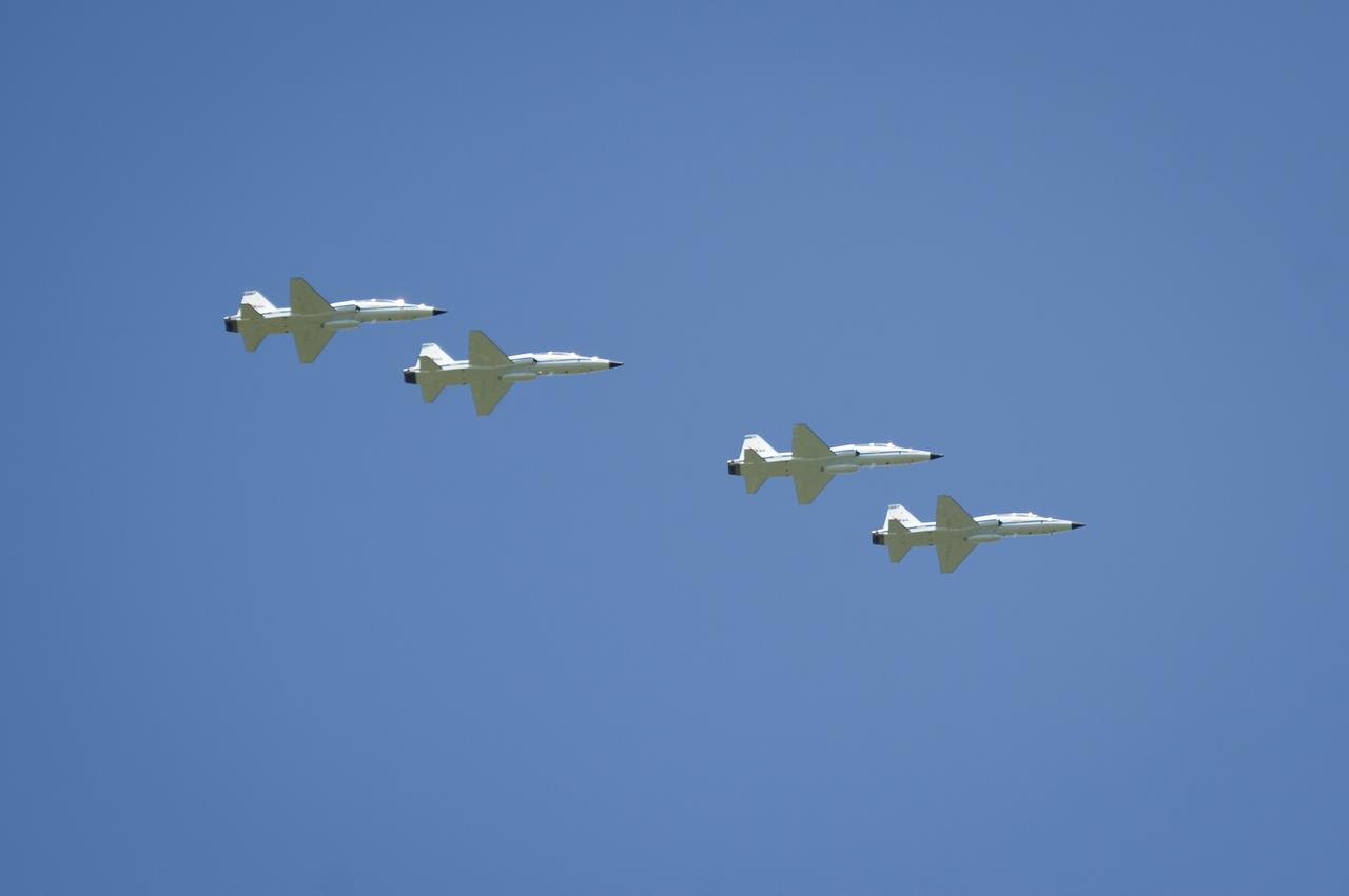 The STS-134 crew flies over the Shuttle Landing Facility (SLF) in T-38 jets on Tuesday, April 26, 2011 at NASA's Kennedy Space Center in Cape Canaveral, Fla., as they arrive for their upcoming mission. During the 14-day mission, the space shuttle Endeavour and its crew will deliver the Alpha Magnetic Spectrometer (AMS) and spare parts including two S-band communications antennas, a high-pressure gas tank and additional spare parts for Dextre. Launch is targeted for Friday, April 29 at 3:47 p.m. EDT.  Photo credit: (NASA/Bill Ingalls)