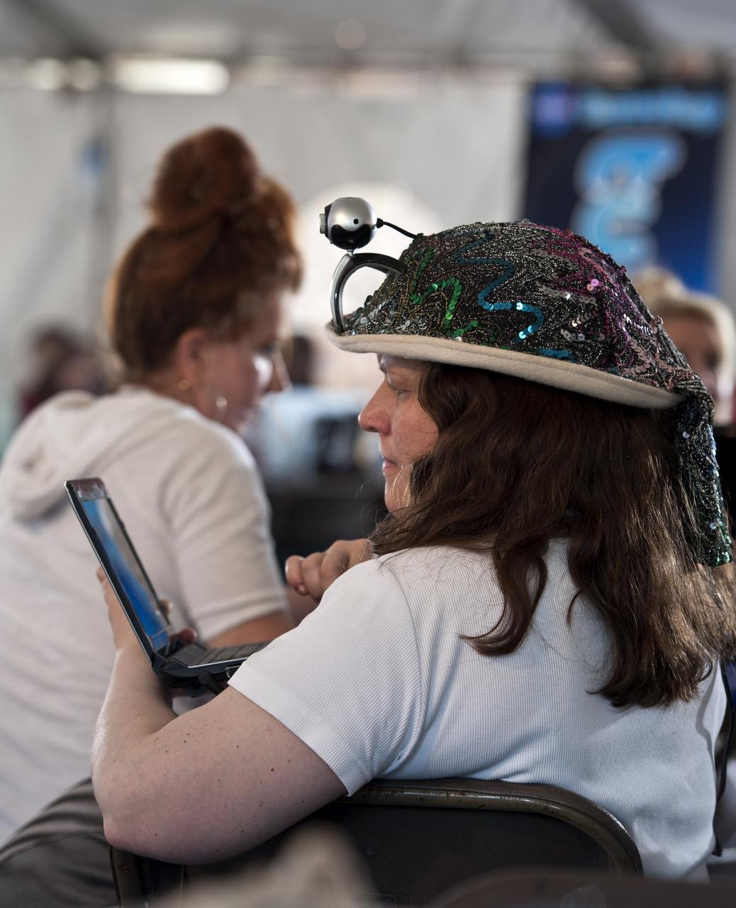 Heather Good, Twitter handle @foundonmars, tweets during the STS-134 Tweetup, Thursday, April 28, 2011, at Kennedy Space Center in Cape Canaveral, Fla. About 150 NASA Twitter followers attended the event. Photo Credit: (NASA/Paul E. Alers)