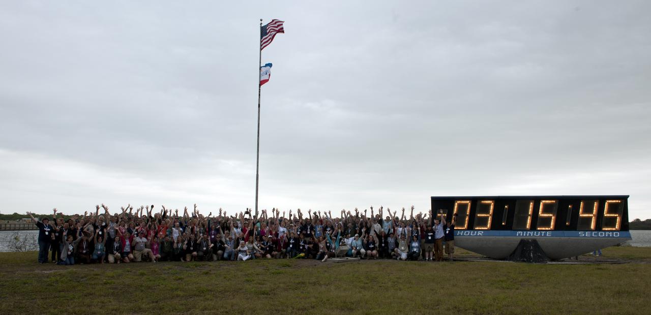 NASA Twitter followers, who particiapted in the STS-134 Tweetup are seen together by the launch clock, Friday, April 29, 2011, at Kennedy Space Center in Cape Canaveral, Fla. About 150 NASA Twitter followers attended the event. Later the group will watch the launch of Endeavour as it heads to the International Space Station on a 14-day mission to deliver the Alpha Magnetic Spectrometer (AMS) and spare parts including two S-band communications antennas, a high-pressure gas tank and additional spare parts for Dextre. Liftoff is targeted for 3:47 pm. Photo Credit: (NASA/Paul E. Alers)