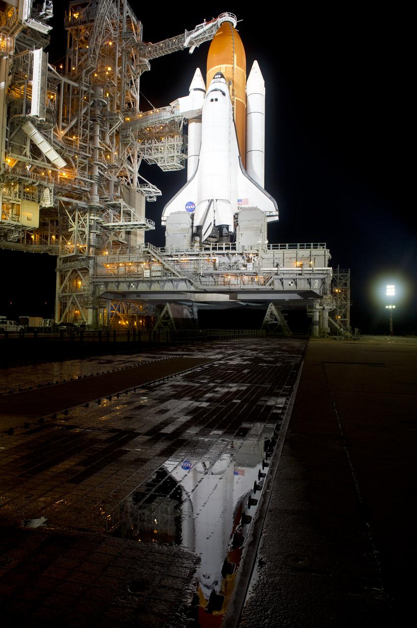 The space shuttle Endeavour is seen on launch pad 39a after the rollback of the Rotating Service Structure (RSS), Thursday, April 28, 2011, at Kennedy Space Center in Cape Canaveral, Fla. During the 14-day mission, Endeavour and the STS-134 crew will deliver the Alpha Magnetic Spectrometer (AMS) and spare parts including two S-band communications antennas, a high-pressure gas tank and additional spare parts for Dextre. Launch is targeted for Friday, April 29 at 3:47 p.m. EDT.  Photo credit: (NASA/Bill Ingalls)
