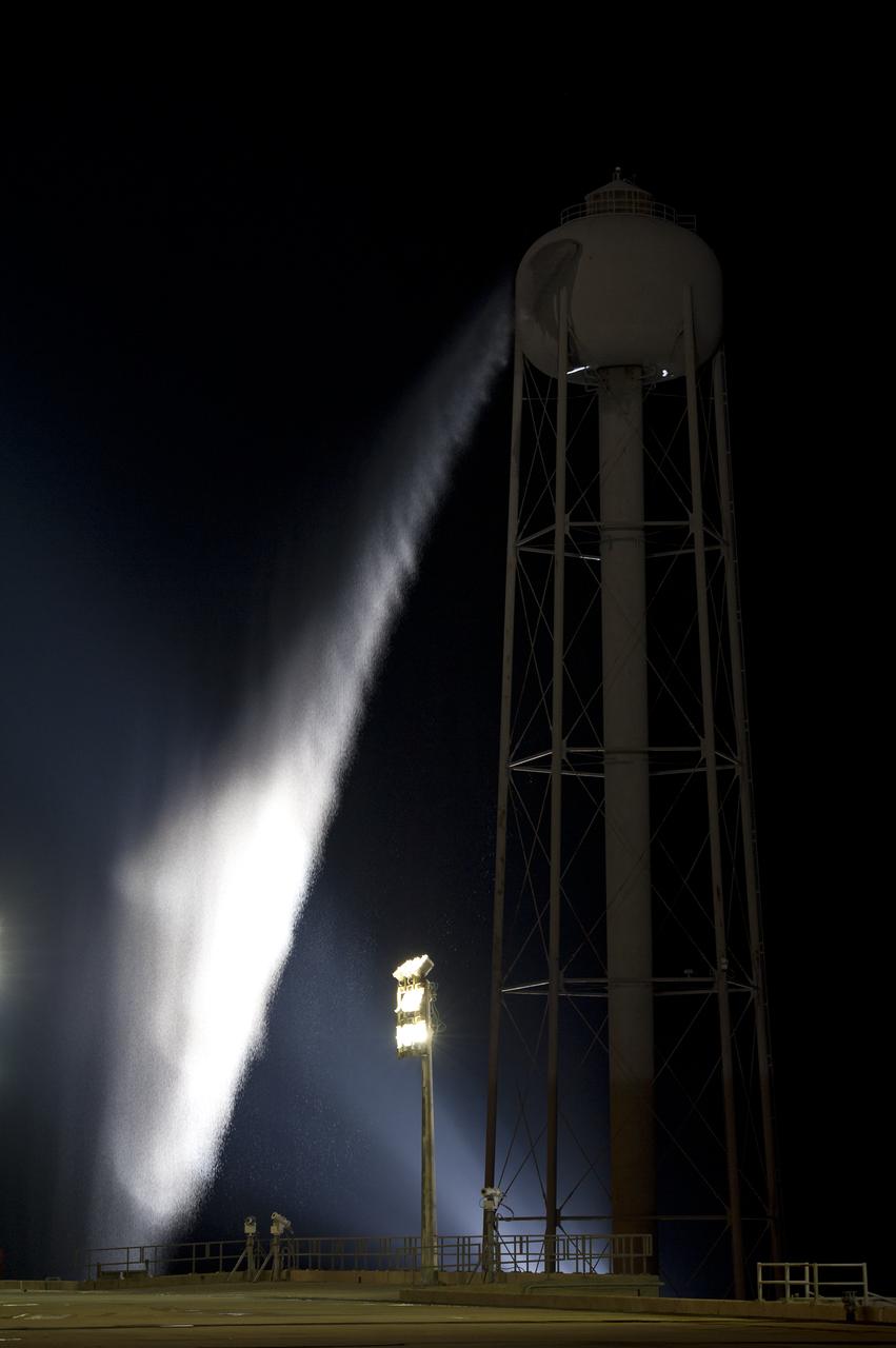 Water pours out of the 290-foot-high tower that holds 300,000 gallons of water used for sound suppression during shuttle launches on launch pad 39a shortly after the rollback of the Rotating Service Structure (RSS) from the space shuttle Endeavour, Thursday, April 28, 2011, at Kennedy Space Center in Cape Canaveral, Fla. During the 14-day mission, Endeavour and the STS-134 crew will deliver the Alpha Magnetic Spectrometer (AMS) and spare parts including two S-band communications antennas, a high-pressure gas tank and additional spare parts for Dextre. Launch is targeted for Friday, April 29 at 3:47 p.m. EDT.  Photo credit: (NASA/Bill Ingalls)