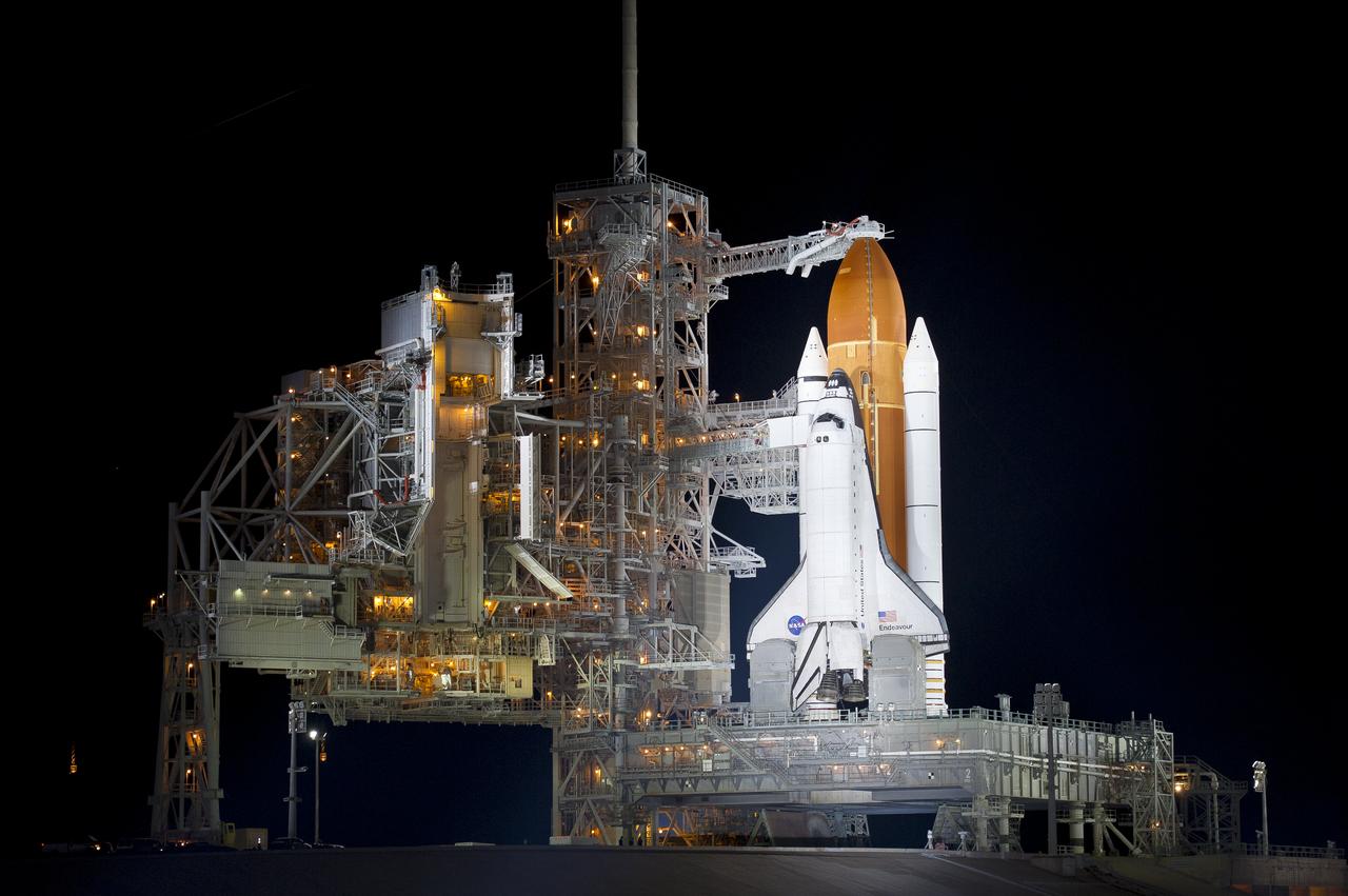 The space shuttle Endeavour is seen on launch pad 39a after the rollback of the Rotating Service Structure (RSS), Thursday, April 28, 2011, at Kennedy Space Center in Cape Canaveral, Fla. During the 14-day mission, Endeavour and the STS-134 crew will deliver the Alpha Magnetic Spectrometer (AMS) and spare parts including two S-band communications antennas, a high-pressure gas tank and additional spare parts for Dextre. Launch is targeted for Friday, April 29 at 3:47 p.m. EDT.  Photo credit: (NASA/Bill Ingalls)