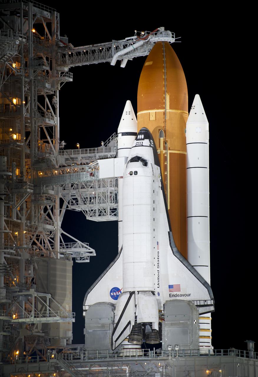 The space shuttle Endeavour is seen on launch pad 39a after the rollback of the Rotating Service Structure (RSS), Thursday, April 28, 2011, at Kennedy Space Center in Cape Canaveral, Fla. During the 14-day mission, Endeavour and the STS-134 crew will deliver the Alpha Magnetic Spectrometer (AMS) and spare parts including two S-band communications antennas, a high-pressure gas tank and additional spare parts for Dextre. Launch is targeted for Friday, April 29 at 3:47 p.m. EDT.  Photo credit: (NASA/Bill Ingalls)