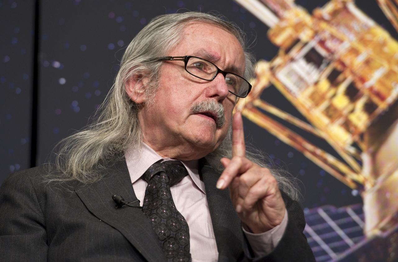 Francis Everitt, Principal Investigator for the Gravity Probe B Mission at Stanford University, makes a point during a press conference, Wednesday, May 4, 2011, to discuss NASA's Gravity Probe B (GP-B) mission which has confirmed two key predictions derived from Albert Einstein's general theory of relativity, which the spacecraft was designed to test at NASA Headquarters in Washington. The experiment, launched in 2004, used four ultra-precise gyroscopes to measure the hypothesized geodetic effect, the warping of space and time around a gravitational body, and frame-dragging, the amount a spinning object pulls space and time with it as it rotates. Photo Credit: (NASA/Paul E. Alers)