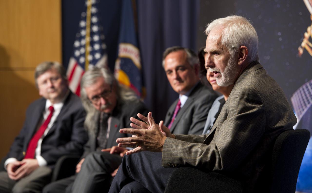 Clifford Will, Professor of Physics at Washington University in St. Louis, foreground, answers questions during a press conference, Wednesday, May 4, 2011, to discuss NASA's Gravity Probe B (GP-B) mission which has confirmed two key predictions derived from Albert Einstein's general theory of relativity, which the spacecraft was designed to test at NASA Headquarters in Washington. The experiment, launched in 2004, used four ultra-precise gyroscopes to measure the hypothesized geodetic effect, the warping of space and time around a gravitational body, and frame-dragging, the amount a spinning object pulls space and time with it as it rotates. Photo Credit: (NASA/Paul E. Alers)