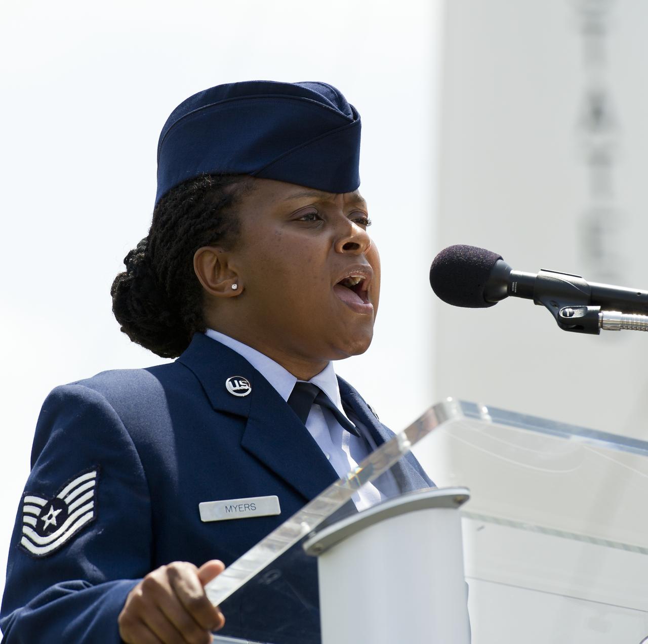 Altrameise Myers, Tech Sgt., 45th Space Wing sings the National Anthem during the start of a ceremony where two USPS stamps where unveiled to commemorate and celebrate 50 years of US Spaceflight and the MESSENGER program during an event, Wednesday, May 4, 2011 at the NASA Kennedy Space Center in Cape Canaveral, Fla.  One stamp commemorates NASA’s Project Mercury, America’s first manned spaceflight program, and NASA astronaut Alan Shepard’s historic flight on May 5, 1961, aboard spacecraft Freedom 7.  The other stamp draws attention to NASA’s unmanned MESSENGER mission, a scientific investigation of the planet Mercury. On March 17, 2011, MESSENGER became the first spacecraft to enter into orbit around Mercury. Photo Credit: (NASA/Bill Ingalls)