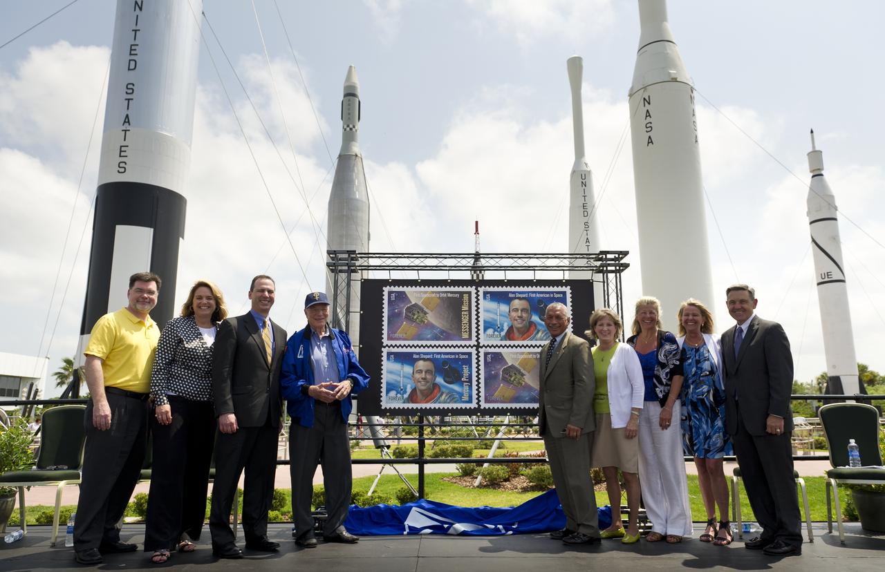 From left, NASA Deputy Director, Planetary Science Division, Science Mission Directorate, Jim Adams, NASA Kennedy Space Center Director of Education and External Relations Cheryl Hurst, United States Postal Service Vice President of Finance Steve Masse, NASA Mercury Astronaut Scott Carpenter, NASA Administrator Charles Boldin, Daughters of NASA astronaut Alan Shepard, Alice Wackermann, Laura Shepard Churchley, and Julie Jenkins, and NASA Kennedy Space Center Director Robert Cabana pose for a photograph during an unveiling ceremony of two USPS stamps that commemorate and celebrate 50 years of US Spaceflight and the MESSENGER program during an event, Wednesday, May 4, 2011 at the NASA Kennedy Space Center in Cape Canaveral, Fla.  One stamp commemorates NASA’s Project Mercury, America’s first manned spaceflight program, and NASA astronaut Alan Shepard’s historic flight on May 5, 1961, aboard spacecraft Freedom 7.  The other stamp draws attention to NASA’s unmanned MESSENGER mission, a scientific investigation of the planet Mercury. On March 17, 2011, MESSENGER became the first spacecraft to enter into orbit around Mercury. Photo Credit: (NASA/Bill Ingalls)