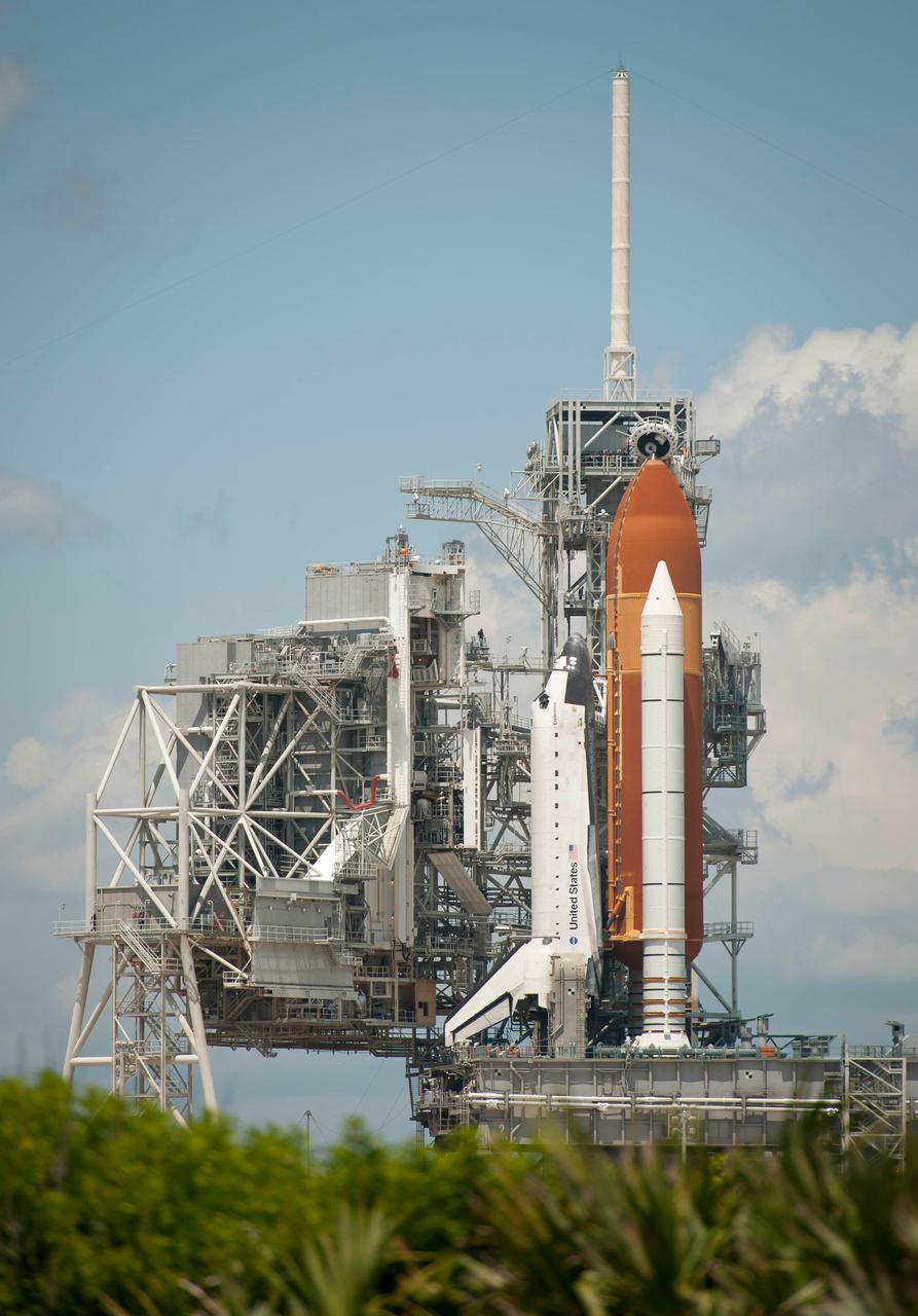 201105150002hq (15  May 2011) --- The space shuttle Endeavour is seen on launch pad 39A after the rollback of the Rotating Service Structure (RSS), May 15, 2011, at Kennedy Space Center in Cape Canaveral, Fla. During the mission, Endeavour and the STS-134 crew will deliver the Alpha Magnetic Spectrometer (AMS) and spare parts including two S-band communications antennas, a high-pressure gas tank and additional spare parts for Dextre. Launch is targeted for May 16 at 8:56 a.m. (EDT).  Photo credit: NASA/Bill Ingalls