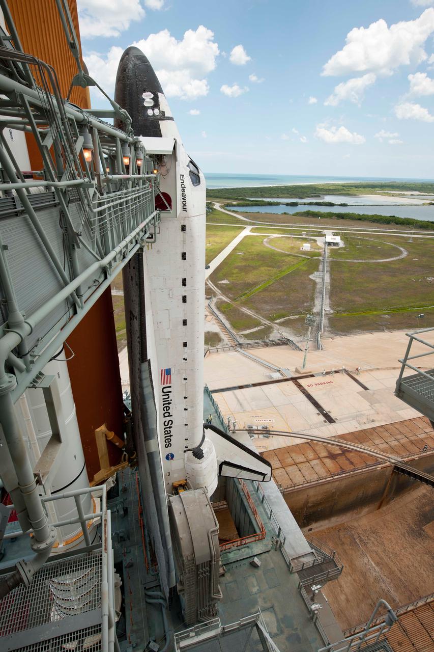 201105150010hq (15  May 2011) --- The space shuttle Endeavour is seen on launch pad 39A after the rollback of the Rotating Service Structure (RSS), May 15, 2011, at Kennedy Space Center in Cape Canaveral, Fla. During the mission, Endeavour and the STS-134 crew will deliver the Alpha Magnetic Spectrometer (AMS) and spare parts including two S-band communications antennas, a high-pressure gas tank and additional spare parts for Dextre. Launch is targeted for May 16 at 8:56 a.m. (EDT).  Photo credit: NASA/Bill Ingalls