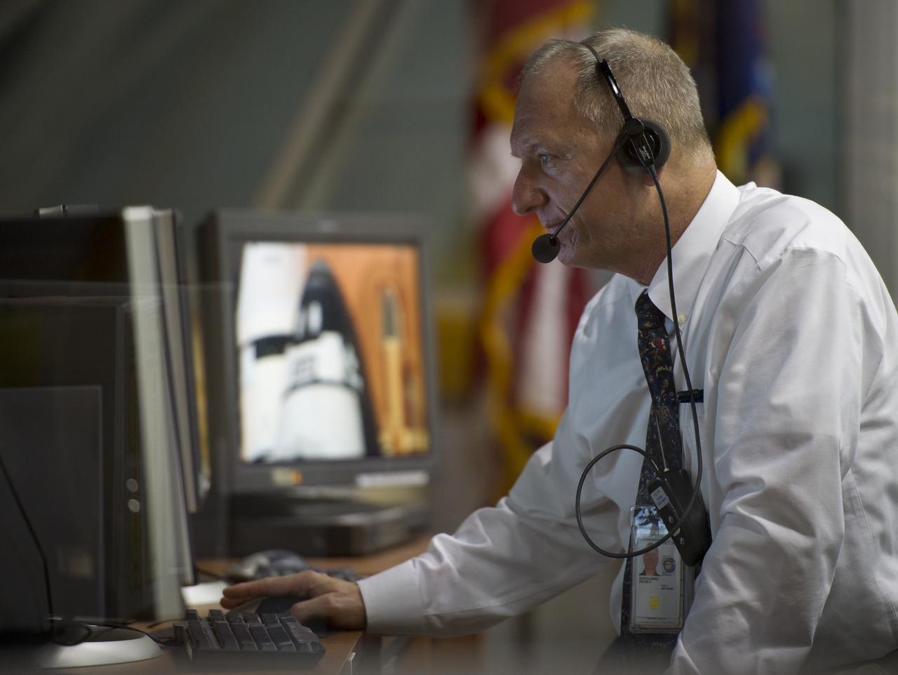 NASA Kennedy Space Center Assistant Launch Director Pete Nickolenko monitors the countdown to the launch of the space shuttle Endeavour (STS-134) from Firing Room Four of the Launch Control Center (LCC), Monday May 16, 2011, at the Kennedy Space Center in Cape Canaveral, Fla.  During the mission, Endeavour and the STS-134 crew will deliver the Alpha Magnetic Spectrometer (AMS) and spare parts including two S-band communications antennas, a high-pressure gas tank and additional spare parts for Dextre. Photo Credit: (NASA/Bill Ingalls)