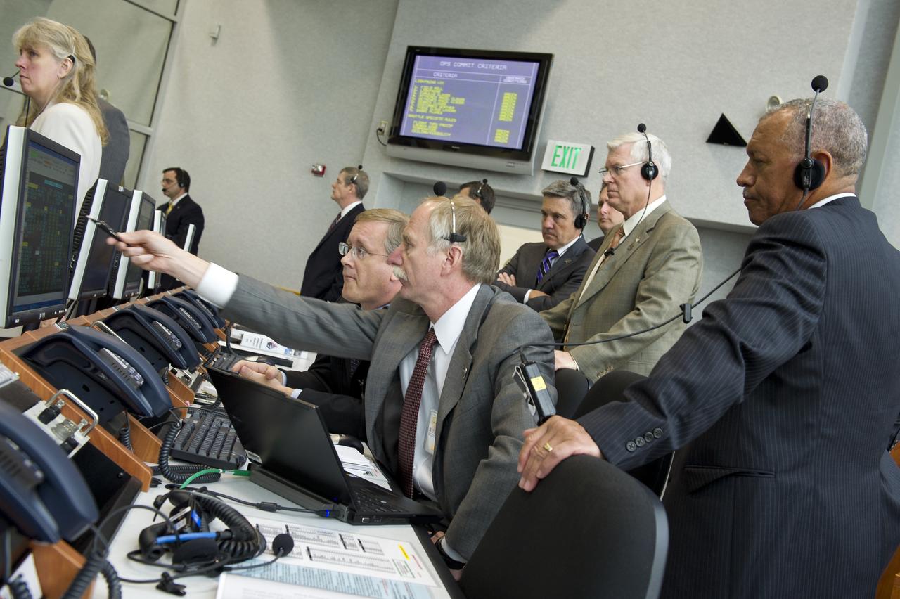 NASA Associate Administrator for Space Operations William Gerstenmaier points to one the monitors in Firing Room Four of the Launch Control Center (LCC) as NASA Administrator Charles Bolden, right, and other NASA managers look on during the launch of the space shuttle Endeavour (STS-134), Monday, May 16, 2011, at Kennedy Space Center in Cape Canaveral, Fla.  During the mission, Endeavour and the STS-134 crew will deliver the Alpha Magnetic Spectrometer (AMS) and spare parts including two S-band communications antennas, a high-pressure gas tank and additional spare parts for Dextre. Photo Credit: (NASA/Bill Ingalls)