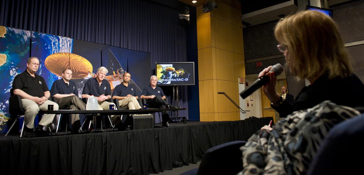 A reporter asks a question to the panel of scientists assembled at the Aquarius/SAC-D press conference on Tuesday, May 17, 2011 at NASA Headquarters in Washington.  Seated from left are Eric Lindstrom, Aquarius Program Scientist, NASA Headquarters; Eric Ianson, Aquarius Program Executive, NASA Headquarters; Gary Lagerloef, Aquarius Principal Investigator, Earth & Space Research, Seattle; Amit Sen, Aquarius Project Manager, NASA Jet Propulsion Laboratory and Daniel Caruso, SAC-D Project Manager, CONAE, Argentina.  The mission will study the salinity of the Earth's oceans from space.  Aquarius/SAC-D is a collaboration between NASA and Argentina's space agency Comision Nacional de Actividades Especiales (CONAE), with participation from Brazil, Canada, France and Italy.  The Aquarius/SAC-D observatory will launch June 9, 2011 from Vandenberg Air Force Base in California.  Photo Credit:  (NASA/Carla Cioffi) 