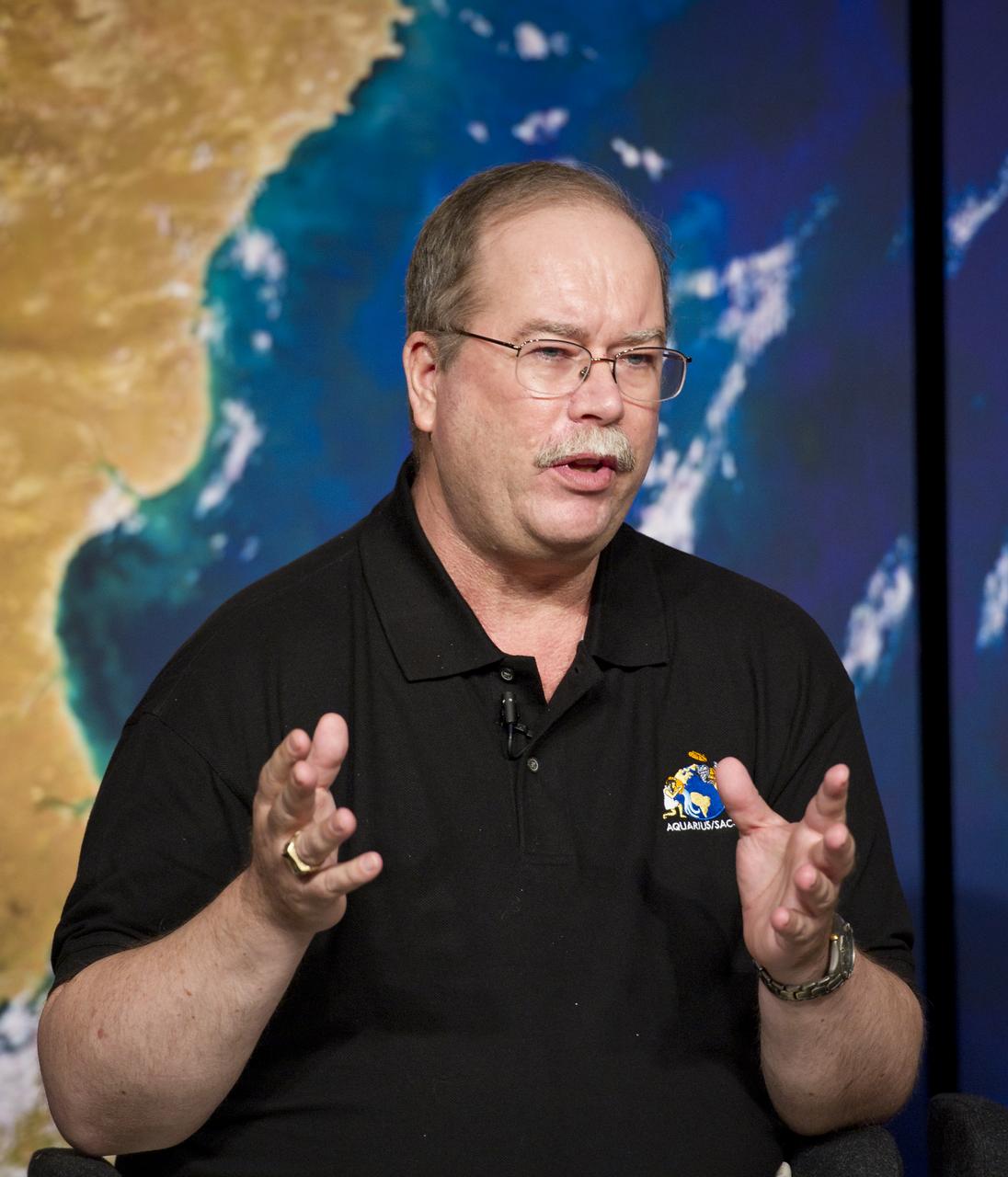 Eric Lindstrom, left, Aquarius Program Scientist, NASA Headquarters, talks about NASA's Aquarius/SAC-D mission to study the salinity of Earth's oceans from space on Tuesday, May 17, 2011 at NASA Headquarters in Washington.  The mission is a collaboration between NASA and Argentina's space agency Comision Nacional de Actividades Especiales (CONAE), with participation from Brazil, Canada, France and Italy.  The Aquarius/SAC-D observatory will launch June 9, 2011 from Vandenberg Air Force Base in California.  Photo Credit:  (NASA/Carla Cioffi)