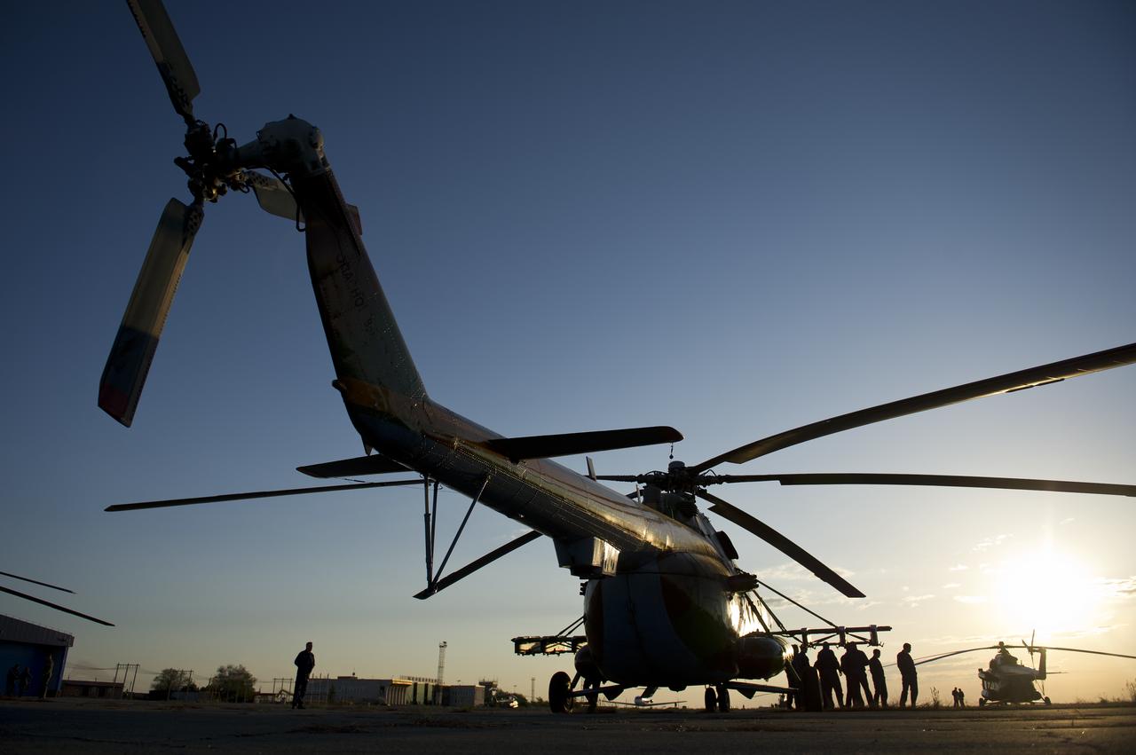 Russian Search and rescue helicopters are seen as they prepare for the landing of the Soyuz TMA-20 spacecraft with Expedition 27 Commander Dmitry Kondratyev and Flight Engineers Paolo Nespoli and Cady Coleman in a remote area southeast of the town of Zhezkazgan, Kazakhstan, on Tuesday, May 24, 2011.   NASA Astronaut Coleman, Russian Cosmonaut Kondratyev and Italian Astronaut Nespoli are returning from more than five months onboard the International Space Station where they served as members of the Expedition 26 and 27 crews. Photo Credit: (NASA/Bill Ingalls)