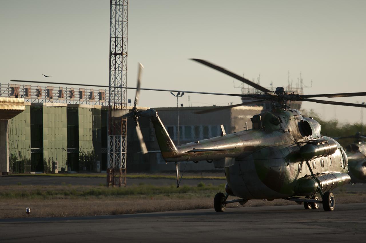 Russian Search and rescue helicopters are seen as they prepare for the landing of the Soyuz TMA-20 spacecraft with Expedition 27 Commander Dmitry Kondratyev and Flight Engineers Paolo Nespoli and Cady Coleman in a remote area southeast of the town of Zhezkazgan, Kazakhstan, on Tuesday, May 24, 2011.   NASA Astronaut Coleman, Russian Cosmonaut Kondratyev and Italian Astronaut Nespoli are returning from more than five months onboard the International Space Station where they served as members of the Expedition 26 and 27 crews. Photo Credit: (NASA/Bill Ingalls)