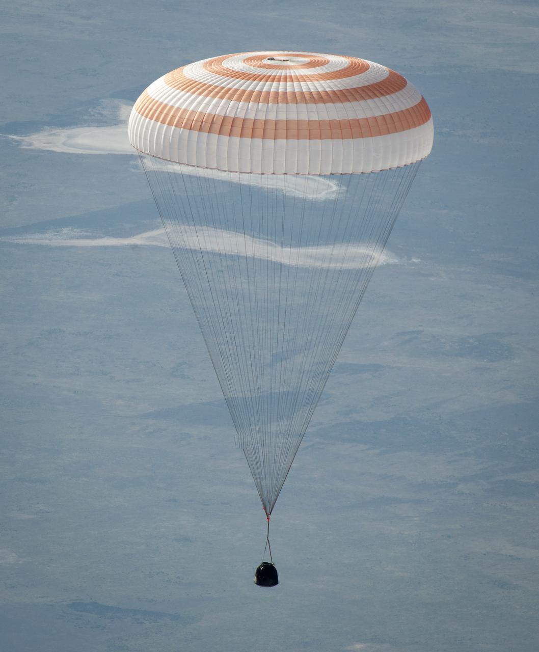 The Soyuz TMA-20 spacecraft is seen as it lands with Expedition 27 Commander Dmitry Kondratyev and Flight Engineers Paolo Nespoli and Cady Coleman in a remote area southeast of the town of Zhezkazgan, Kazakhstan, on Tuesday, May 24, 2011. NASA Astronaut Coleman, Russian Cosmonaut Kondratyev and Italian Astronaut Nespoli are returning from more than five months onboard the International Space Station where they served as members of the Expedition 26 and 27 crews. Photo Credit: (NASA/Bill Ingalls)