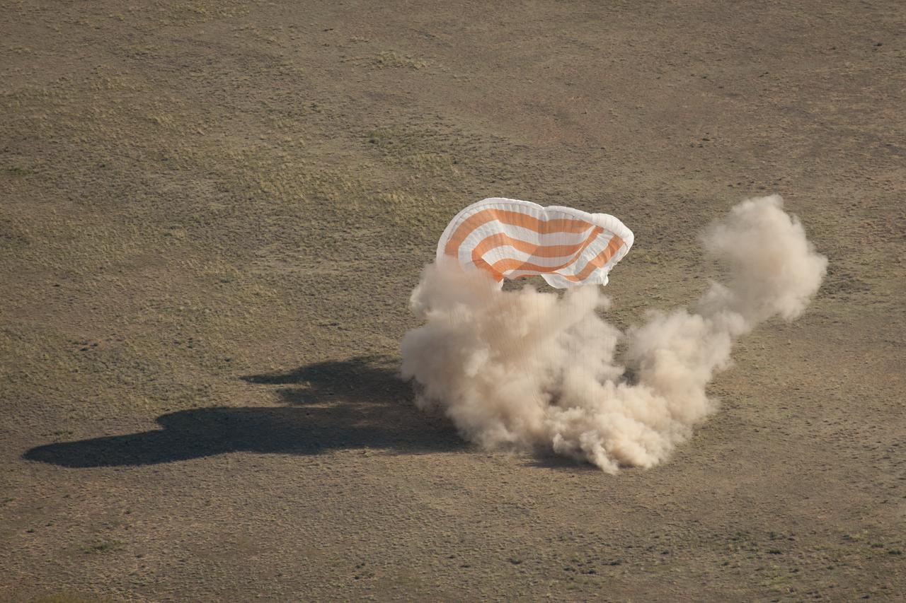 The Soyuz TMA-20 spacecraft is seen as it lands with Expedition 27 Commander Dmitry Kondratyev and Flight Engineers Paolo Nespoli and Cady Coleman in a remote area southeast of the town of Zhezkazgan, Kazakhstan, on Tuesday, May 24, 2011. NASA Astronaut Coleman, Russian Cosmonaut Kondratyev and Italian Astronaut Nespoli are returning from more than five months onboard the International Space Station where they served as members of the Expedition 26 and 27 crews. Photo Credit: (NASA/Bill Ingalls)