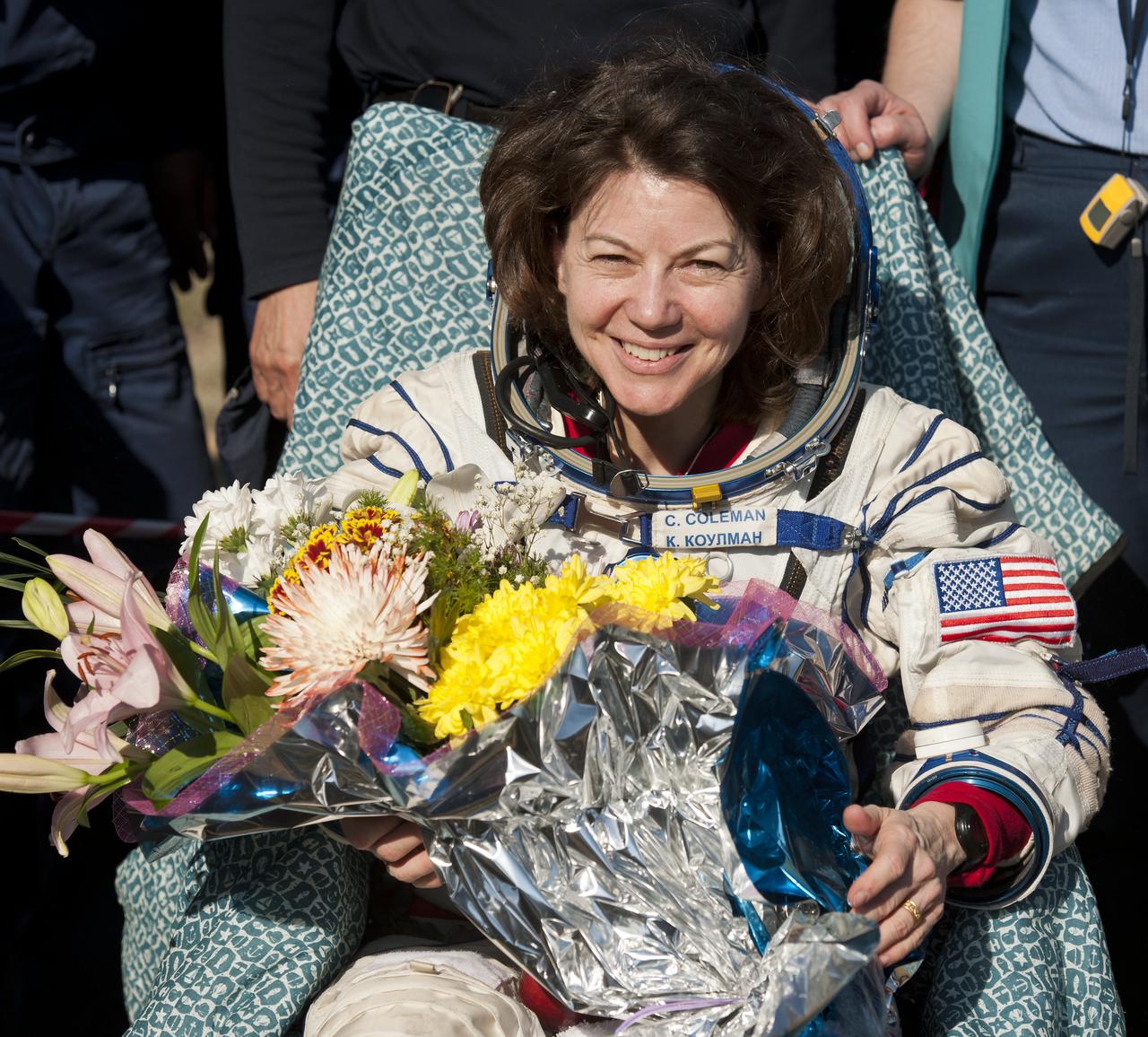 Expedition 27 Flight Engineer Cady Coleman smiles shortly after she and Commander Dmitry Kondratyev and Flight Engineer Paolo Nespoli landed in their Soyuz TMA-20 southeast of the town of Zhezkazgan, Kazakhstan, on Tuesday, May 24, 2011.  NASA Astronaut Coleman, Russian Cosmonaut Kondratyev and Italian Astronaut Nespoli are returning from more than five months onboard the International Space Station where they served as members of the Expedition 26 and 27 crews. Photo Credit: (NASA/Bill Ingalls)