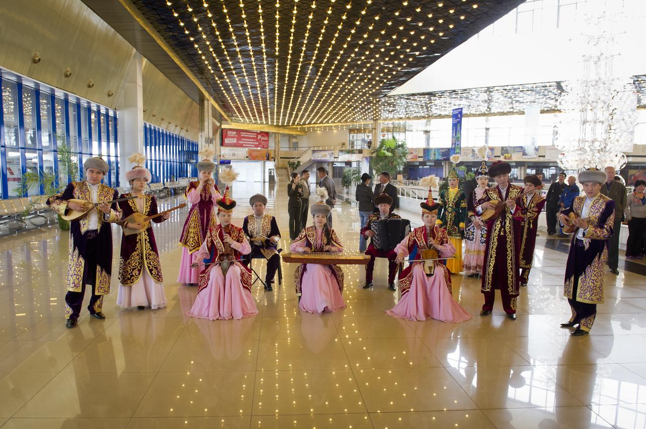 Kazakh performers at the Karaganda Airport in Kazakhstan play music prior to a welcome home ceremony for Expedition 27 Commander Dmitry Kondratyev, and, Flight Engineers Paolo Nespoli, and Cady Coleman, after the three landed in their Soyuz TMA-20 spacecraft in a remote area southeast of the town of Zhezkazgan, Kazakhstan, on Tuesday, May 24, 2011. NASA Astronaut Coleman, Russian Cosmonaut Kondratyev and Italian Astronaut Nespoli are returning from more than five months onboard the International Space Station where they served as members of the Expedition 26 and 27 crews. Photo Credit: (NASA/Bill Ingalls)