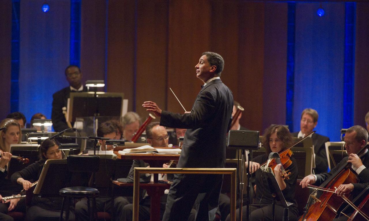 Emil de Cou conducts the Space Philharmonic during a program entitled Human Spaceflight: The Kennedy Legacy, Wednesday, May 25, 2011, in the concert hall at the John F. Kennedy Center for the Performing Arts in Washington. The event marked the 50th Anniversary of President John F. Kennedy's Special Message to the Congress on Urgent National Needs in which he stated "landing a man on the moon and returning him safely to earth". Photo Credit: (NASA/Paul E. Alers)