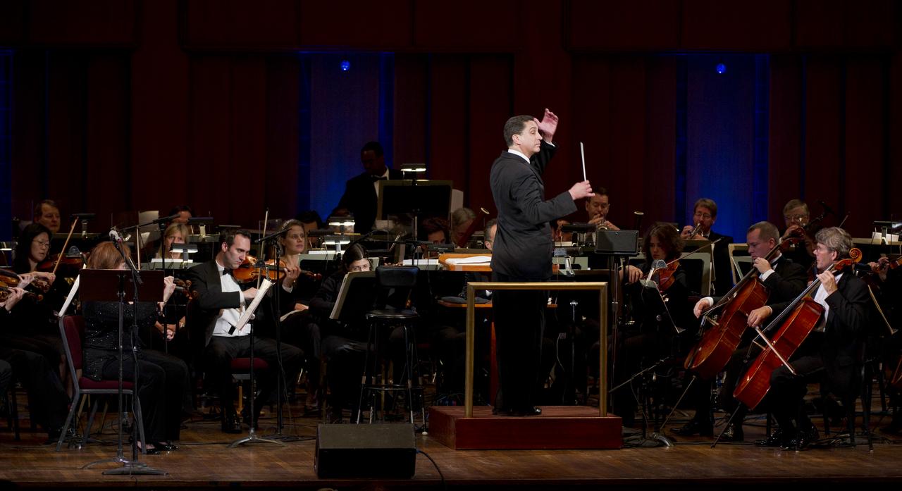 Emil de Cou conducts the Space Philharmonic during a program entitled Human Spaceflight: The Kennedy Legacy, Wednesday, May 25, 2011, in the concert hall at the John F. Kennedy Center for the Performing Arts in Washington. The event marked the 50th Anniversary of President John F. Kennedy's Special Message to the Congress on Urgent National Needs in which he stated "landing a man on the moon and returning him safely to earth". Photo Credit: (NASA/Paul E. Alers)