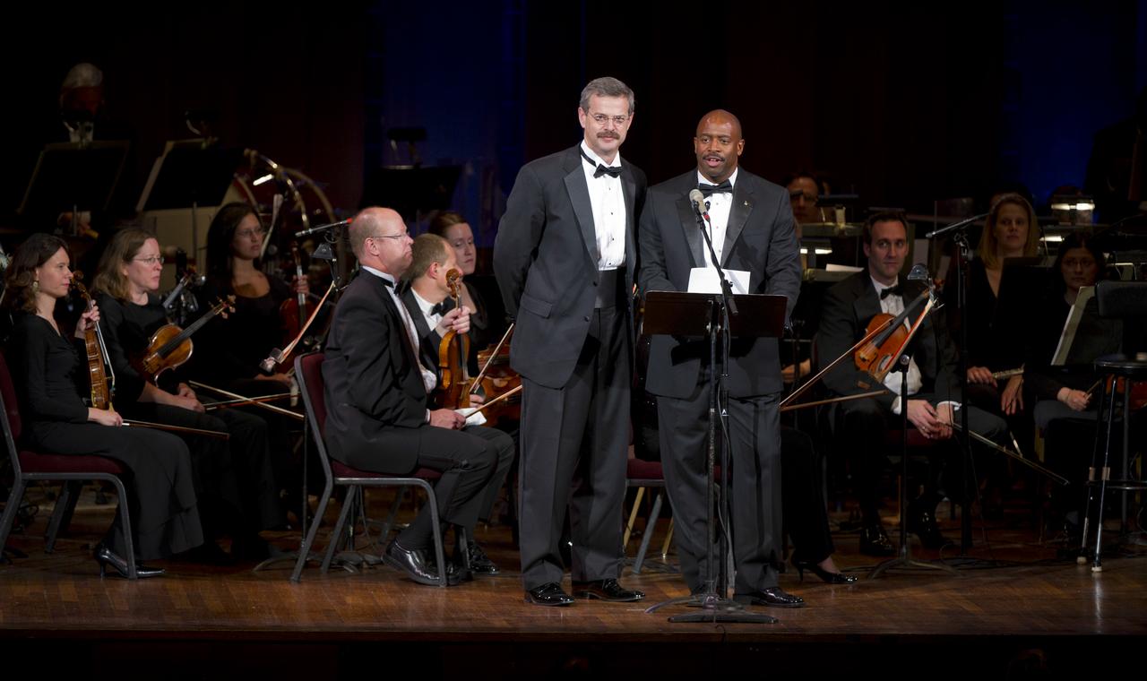 Astronauts Scott Altman, left, and Leland Melvin speak of their fallen comrades during a program commemorating Human Spaceflight and the Kennedy Legacy, Wednesday, May 25, 2011, in the concert hall at the John F. Kennedy Center for the Performing Arts in Washington. The event marked the 50th Anniversary of President John F. Kennedy's Special Message to the Congress on Urgent National Needs in which he stated "landing a man on the moon and returning him safely to earth". Photo Credit: (NASA/Paul E. Alers)