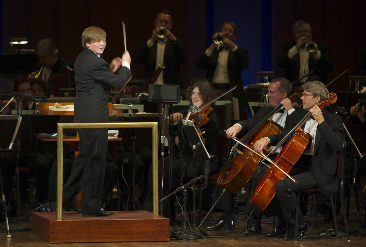 Ted Kennedy III guest conducts the Space Philharmonic during a program commemorating Human Spaceflight and the Kennedy Legacy, Wednesday, May 25, 2011, in the concert hall at the John F. Kennedy Center for the Performing Arts in Washington. The event marked the 50th Anniversary of President John F. Kennedy's Special Message to the Congress on Urgent National Needs in which he stated "landing a man on the moon and returning him safely to earth". Photo Credit: (NASA/Paul E. Alers)