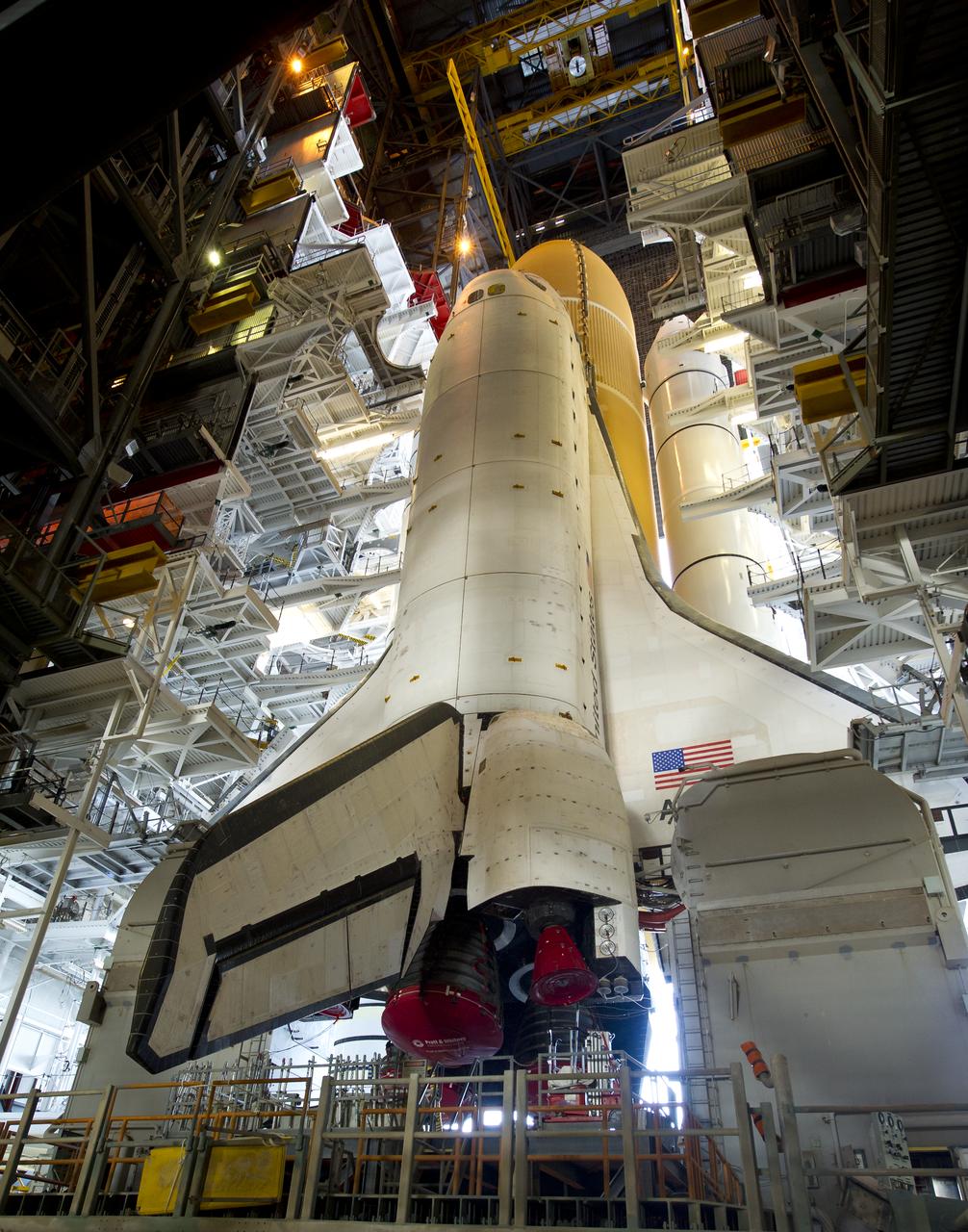 Space Shuttle Atlantis (STS-135) is seen atop a Mobile Launcher Platform (MLP) just prior to beginning its journey from High Bay 3 in the Vehicle Assembly Building to Launch Pad 39a for its final flight, Tuesday evening, May 31, 2011, at Kennedy Space Center in Cape Canaveral, Fla. The 3.4-mile trek, known as "rollout," will take about seven hours to complete. Atlantis will carry the Raffaello multipurpose logistics module to deliver supplies, logistics and spare parts to the International Space Station. The launch of STS-135 is targeted for July 8. Photo Credit: (NASA/Bill Ingalls)