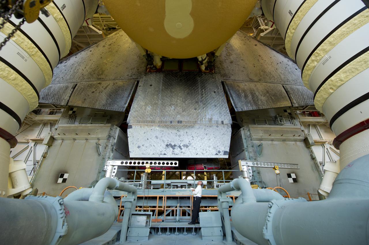 NASA Administrator Charles Bolden looks at the space shuttle Atlantis atop of the Mobile Launch Platform (MLP) just prior to rollout of Atlantis (STS-135) from High Bay 3 in the Vehicle Assembly Building to Launch Pad 39a for its final flight, Tuesday evening, May 31, 2011, at Kennedy Space Center in Cape Canaveral, Fla. The 3.4-mile trek, known as "rollout," will take about seven hours to complete. Atlantis will carry the Raffaello multipurpose logistics module to deliver supplies, logistics and spare parts to the International Space Station. The launch of STS-135 is targeted for July 8. Photo Credit: (NASA/Bill Ingalls)
