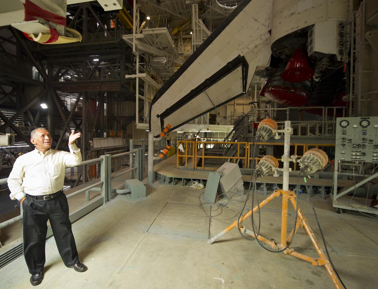 NASA Administrator Charles Bolden looks at the space shuttle Atlantis atop of the Mobile Launch Platform (MLP) just prior to rollout of Atlantis (STS-135) from High Bay 3 in the Vehicle Assembly Building to Launch Pad 39a for its final flight, Tuesday evening, May 31, 2011, at Kennedy Space Center in Cape Canaveral, Fla. The 3.4-mile trek, known as "rollout," will take about seven hours to complete. Atlantis will carry the Raffaello multipurpose logistics module to deliver supplies, logistics and spare parts to the International Space Station. The launch of STS-135 is targeted for July 8. Photo Credit: (NASA/Bill Ingalls)