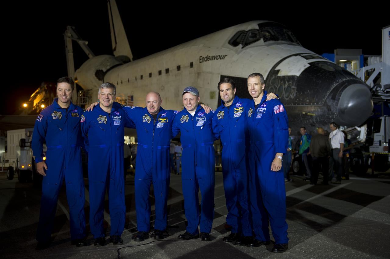 The STS-134 astronauts from left, European Space Agency's Roberto Vittori, Gregory H. Johnson, pilot; Mark Kelly, commander; Michael Fincke, Greg Chamitoff, and Andrew Feustel all mission specialists, pose for a group photograph shortly after landing onboard the space shuttle Endeavour at the Shuttle Landing Facility (SLF) at Kennedy Space Center, Wednesday, June 1, 2011, in Cape Canaveral, Fla. Endeavour, completing a 16-day mission to outfit the International Space Station, spent 299 days in space and traveled more than 122.8 million miles during its 25 flights. It launched on its first mission on May 7, 1992. Photo Credit: (NASA/Bill Ingalls)