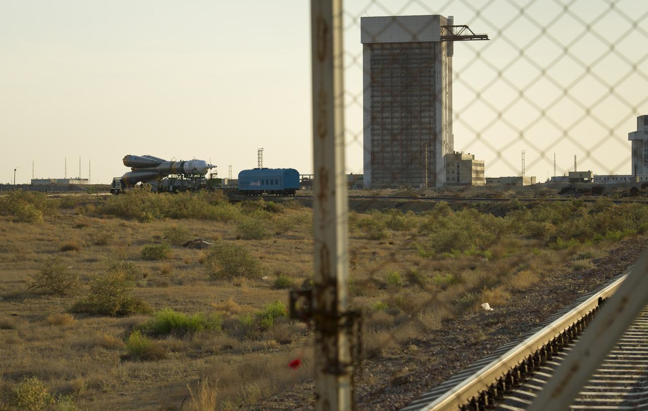 The Soyuz TMA-02M spacecraft is seen in the distance on its way to the launch pad at the Baikonur Cosmodrome, Kazakhstan, Sunday, June 5, 2011.  The launch of the Soyuz spacecraft with Expedition 28 Soyuz Commander Sergei Volkov of Russia, NASA Flight Engineer Mike Fossum and JAXA (Japan Aerospace Exploration Agency) Flight Engineer Satoshi Furukawa is scheduled for 2:15 a.m. local time on Wednesday, June 8, 2011.  Photo Credit (NASA/Carla Cioffi)