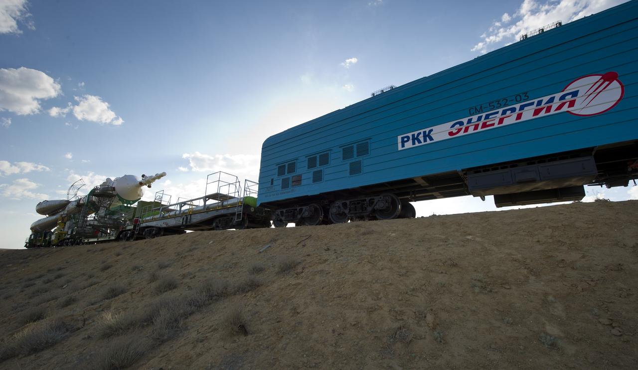 The Soyuz TMA-02M spacecraft is rolled out by train on its way to the launch pad at the Baikonur Cosmodrome, Kazakhstan, Sunday, June 5, 2011.  The launch of the Soyuz spacecraft with Expedition 28 Soyuz Commander Sergei Volkov of Russia, NASA Flight Engineer Mike Fossum and JAXA (Japan Aerospace Exploration Agency) Flight Engineer Satoshi Furukawa is scheduled for 2:15 a.m. local time on Wednesday, June 8, 2011.  Photo Credit (NASA/Carla Cioffi)
